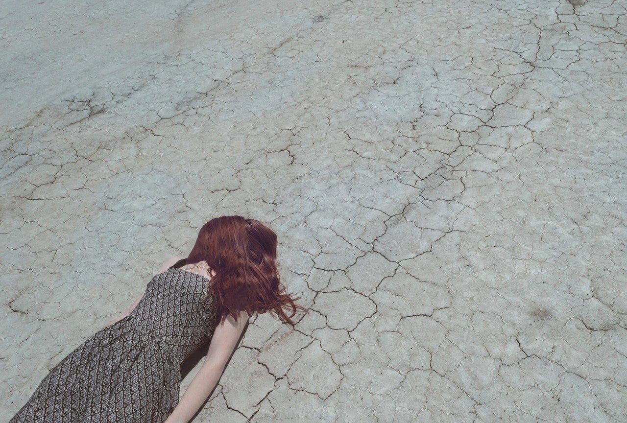 woman's face covered by her hair