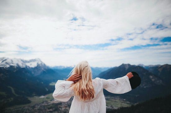 Solo traveler taking in a view of the mountains