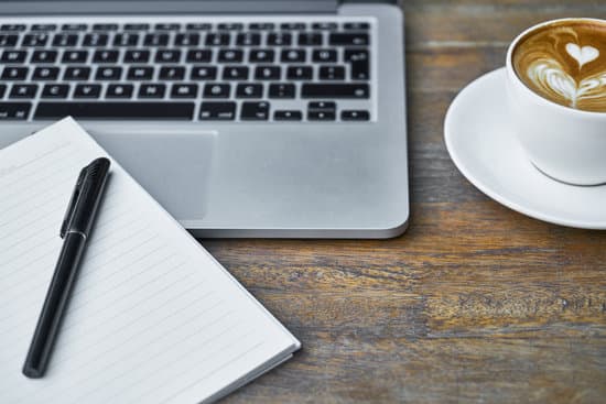 An image of a laptop and coffee