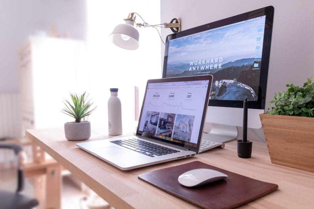 Laptop and monitor sitting on a table