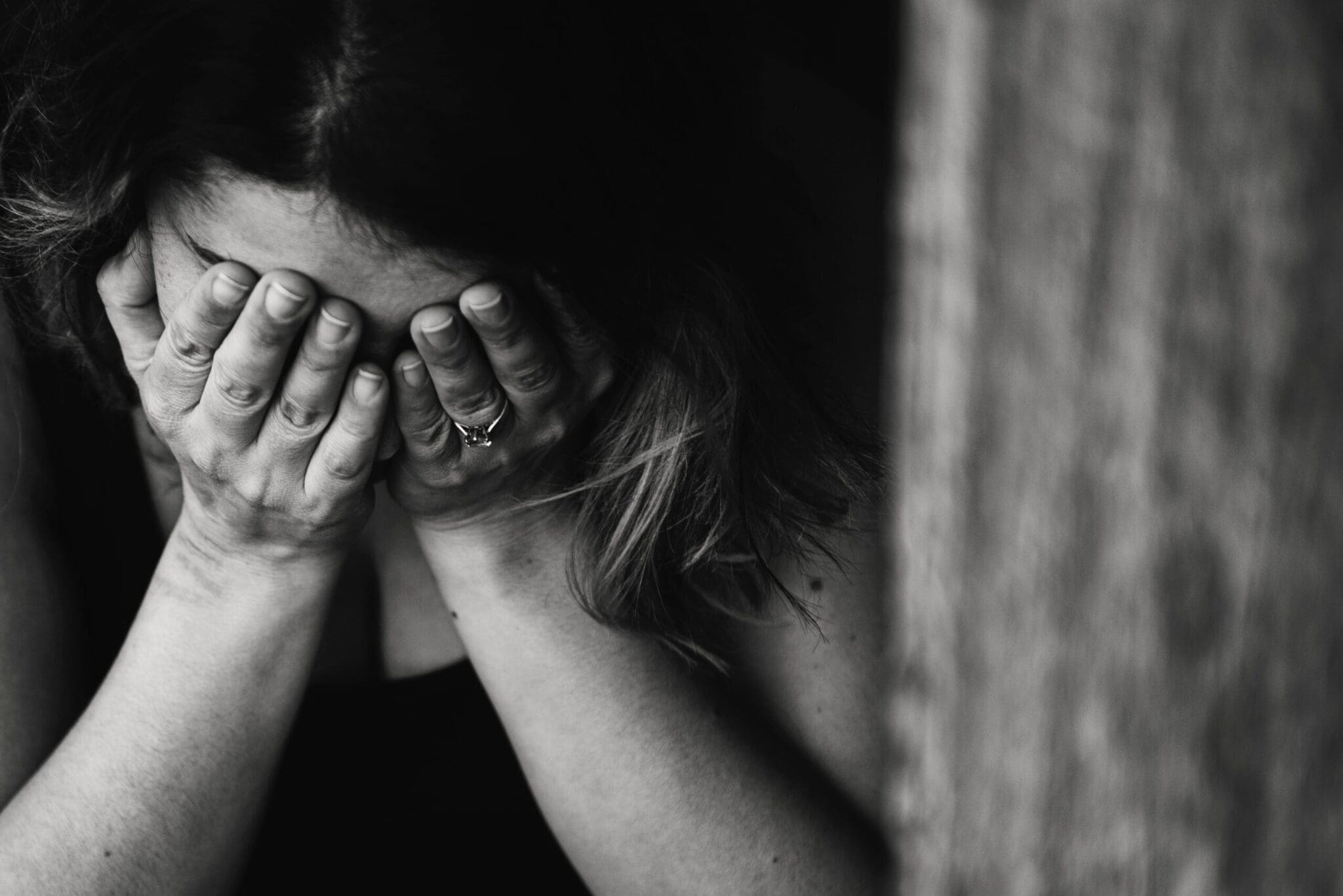 woman in anguish over dealing with a toxic elderly parent